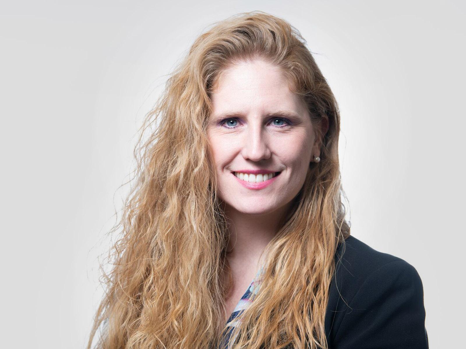 Woman with smile and long red hair