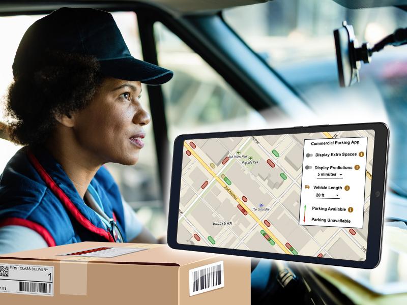 Woman in delivery truck looking at parking webapp