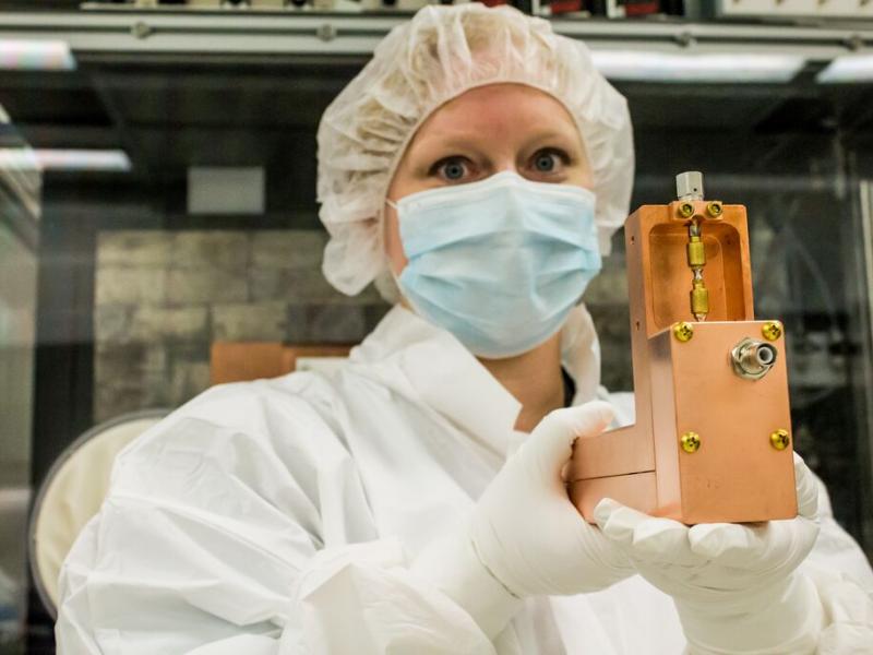 PNNL physicist Emily Mace holding a copper radiation detector