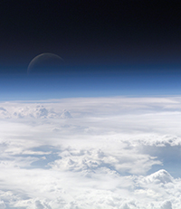 satellite view of top of atmosphere with moon