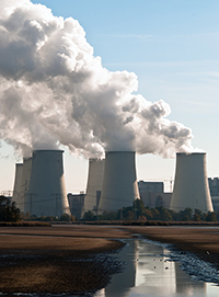 cooling towers of coal-fired power plant near river