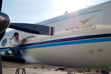 Researcher John Hubbe adjusts a temperature probe on the G-1 Gulfstream research aircraft in preparation for the 2008 field campaign in Chile.