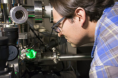 Danny Perea looks into an atom probe