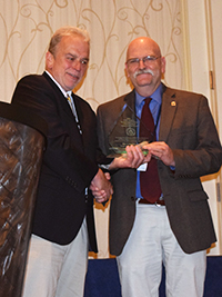 Dr. Charles Peden accepting award