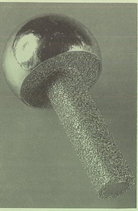 archival black and white photo of a prosthetic attachment pin with a porous surface texture