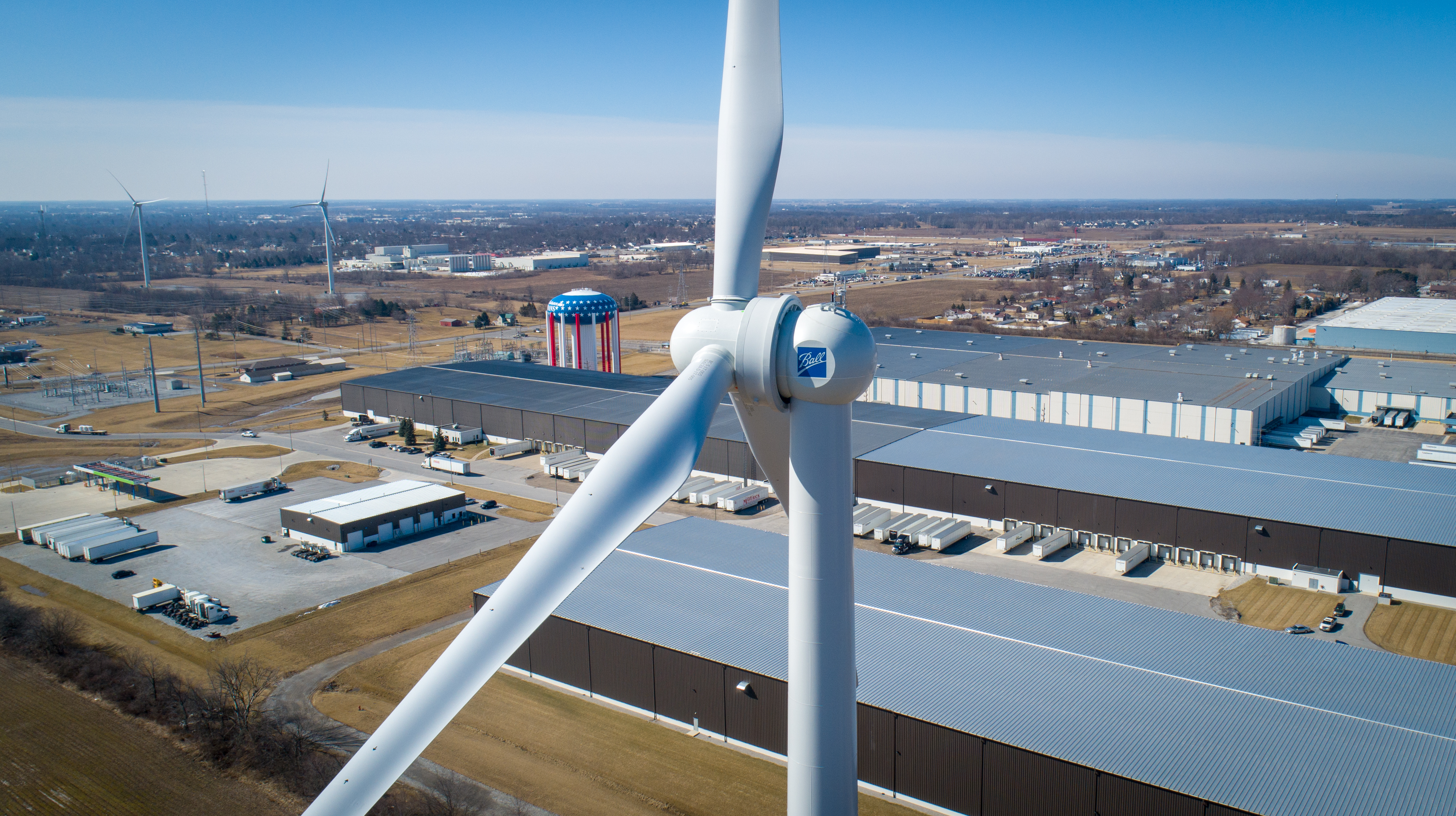 Turbine hovering above manufacturing facilities