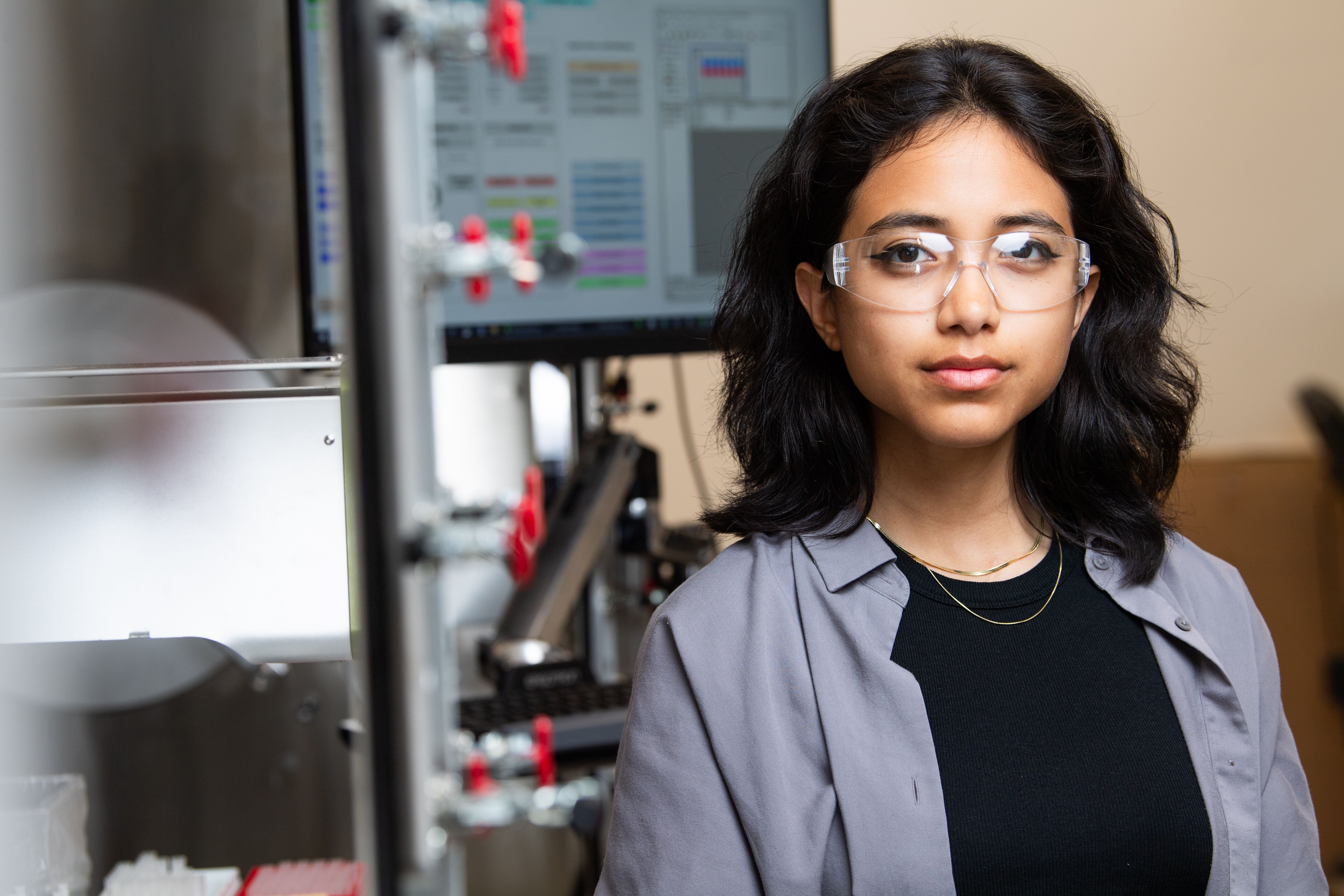 Alysson Bermudez, inside the Grid Storage Launchpad facility, wearing safety eyewear.