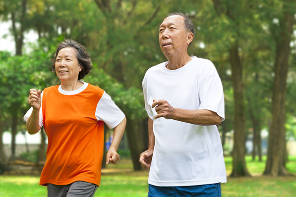 an older man and woman running