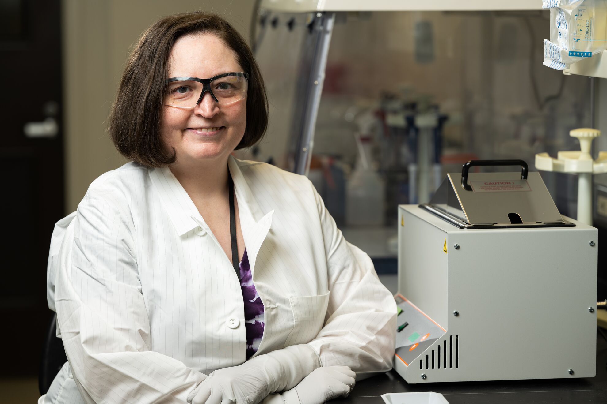 Becky Hess, who studies pathogens in permafrost, in her laboratory.