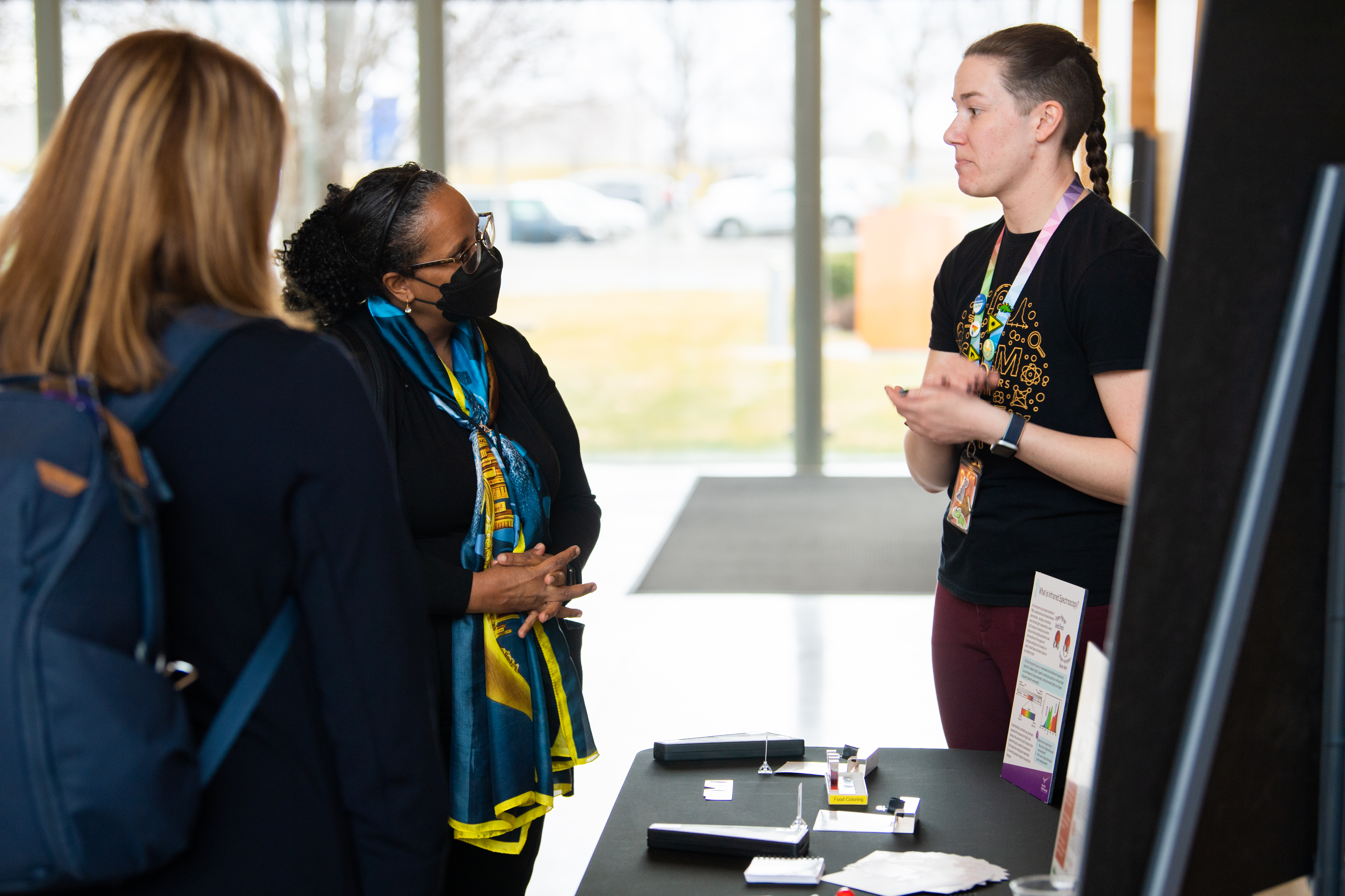 Dr. Berhe in a conversation with student STEM ambassador. 