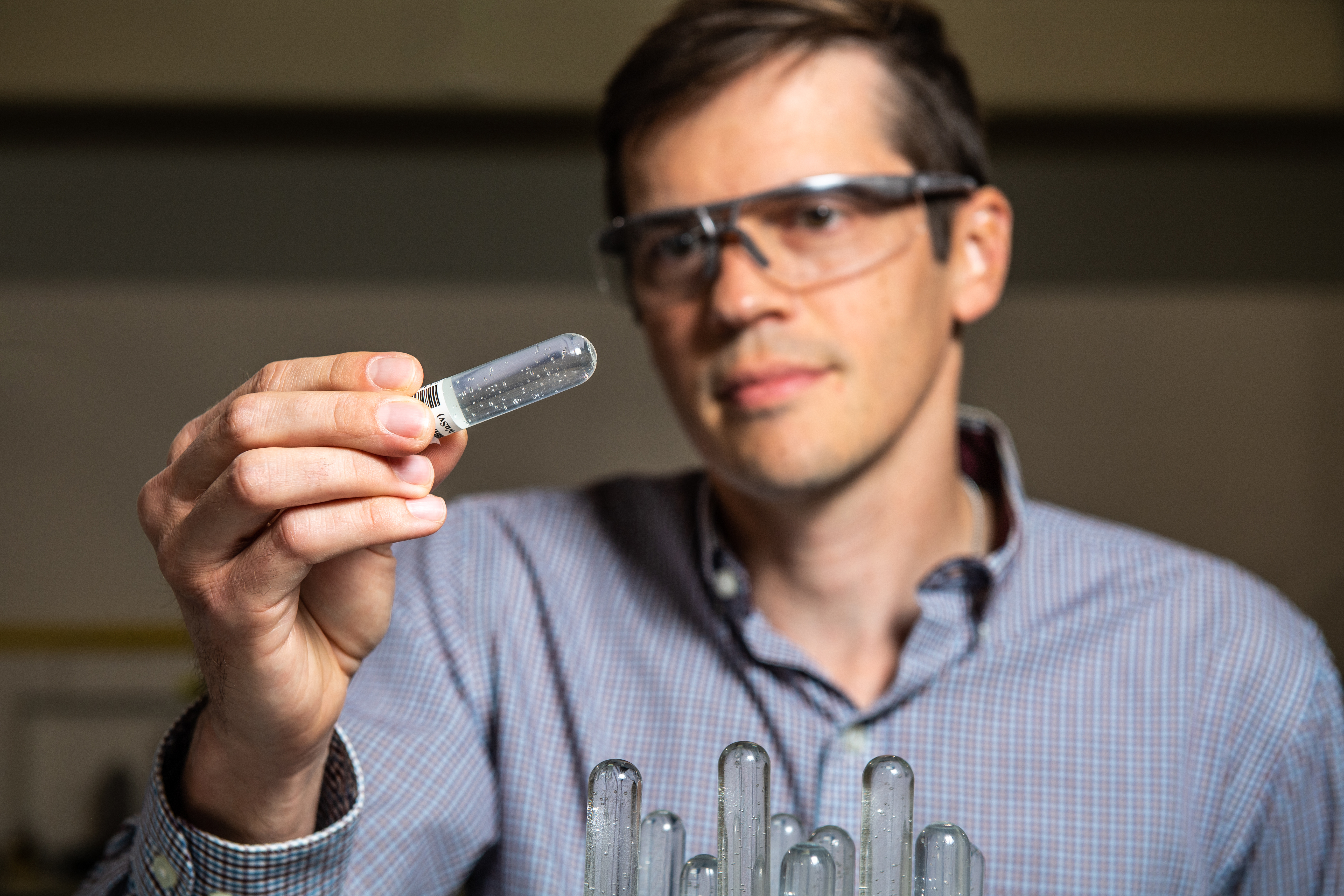 Photo of scientist holding droplet tube