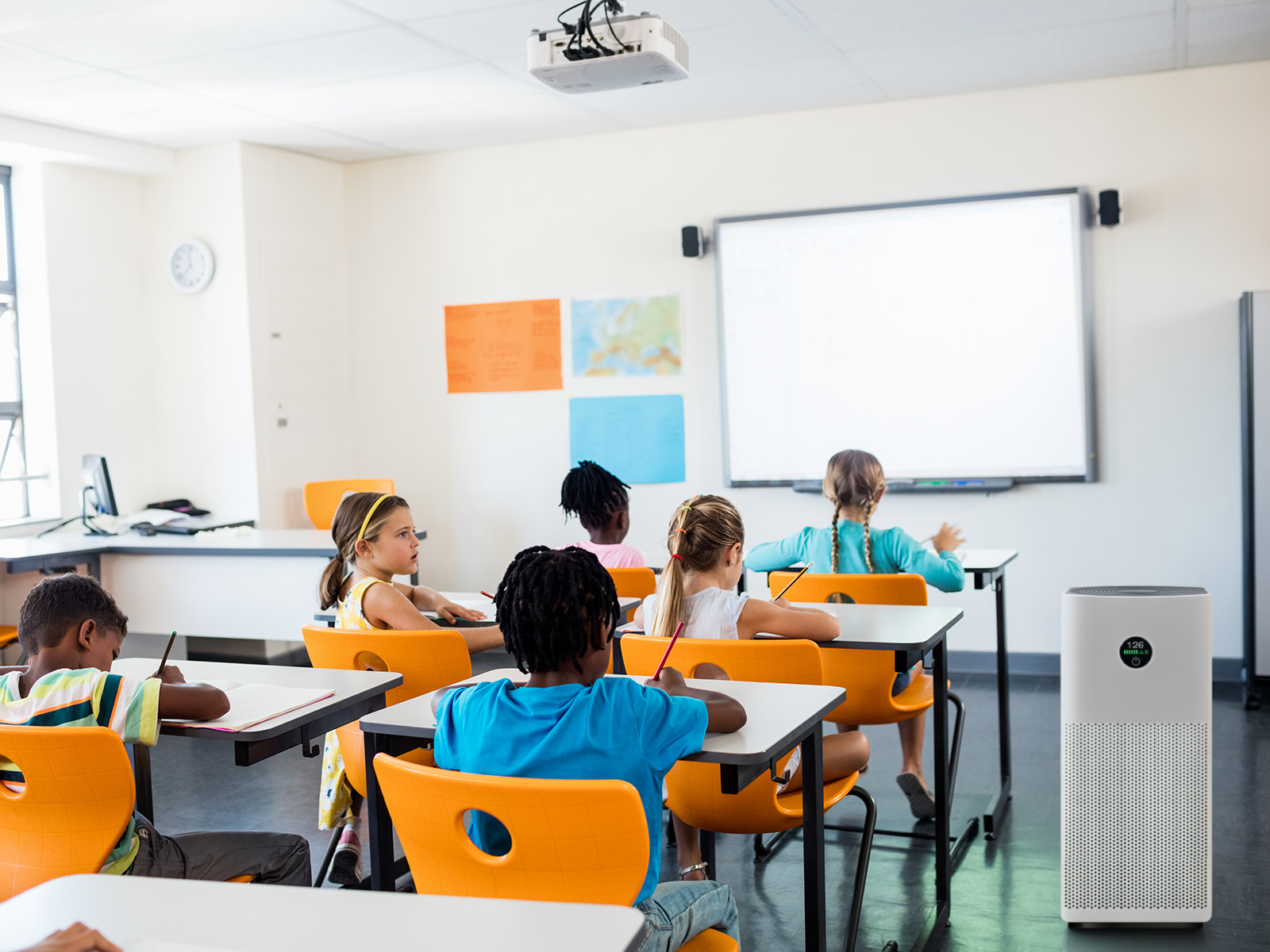 Classroom with children and portable air cleaner.