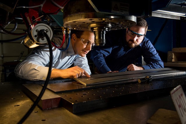 Researchers use the friction stir processing machine at PNNL