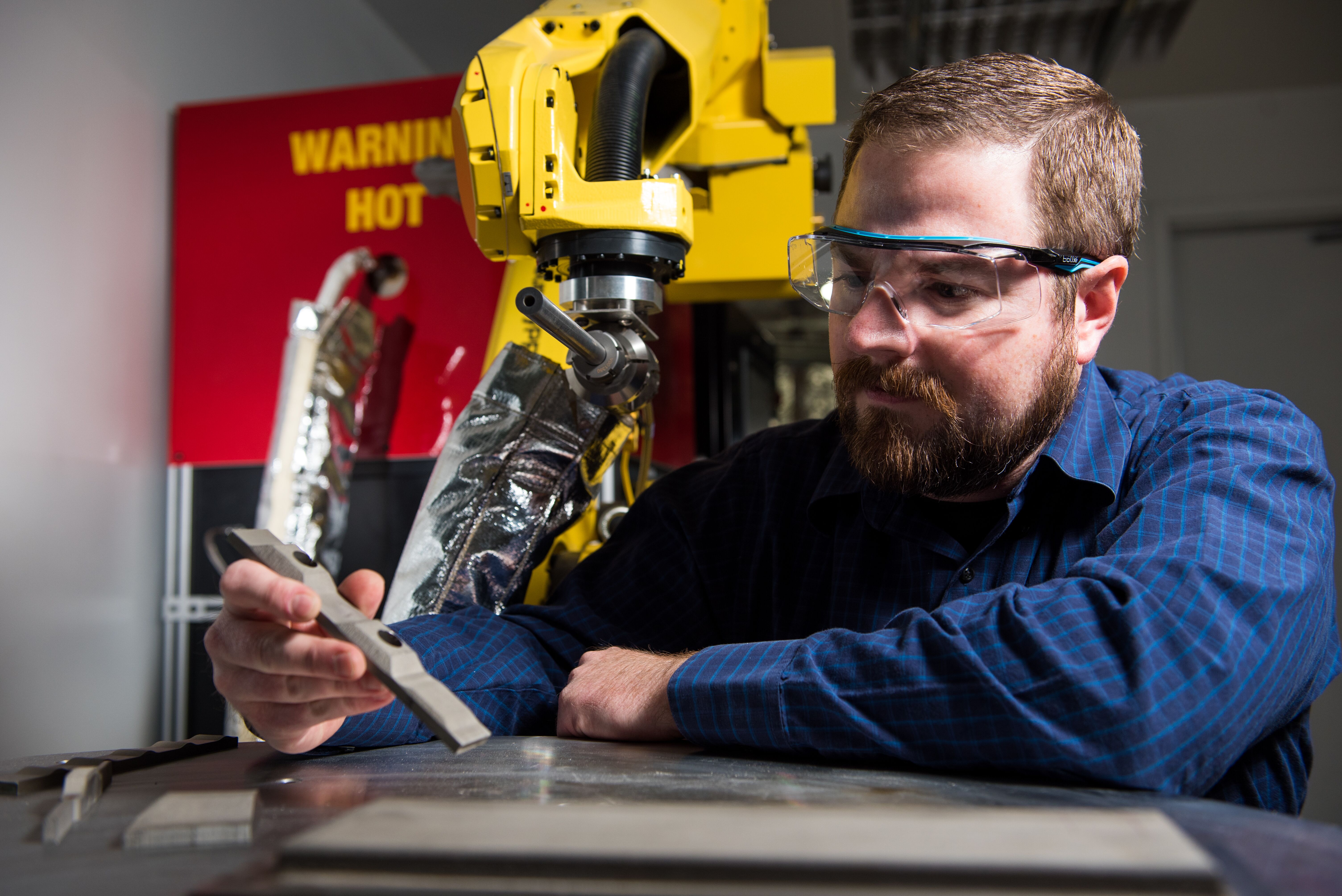 Researcher working with Cold Spray Machine