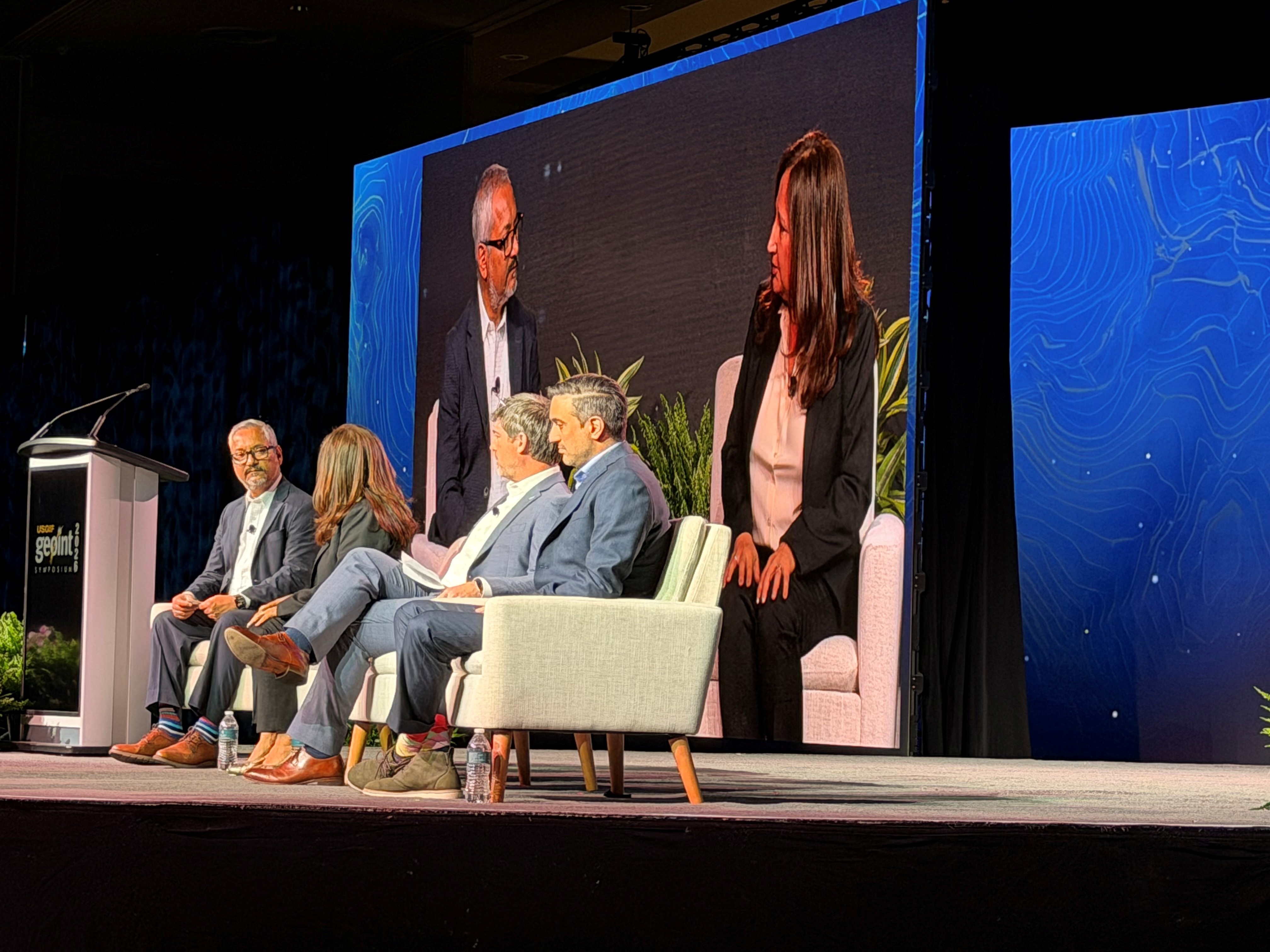 A photo of panelists at the national laboratory panel at a GEOINT conference