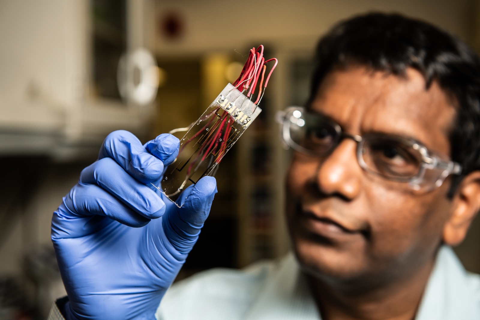 scientist examining sensor technology