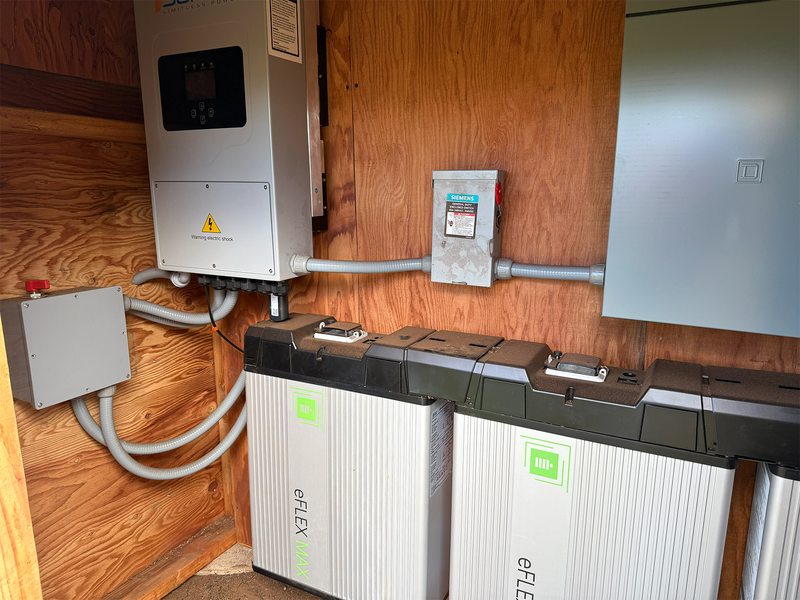Battery storage systems attached to the interior of a wall.