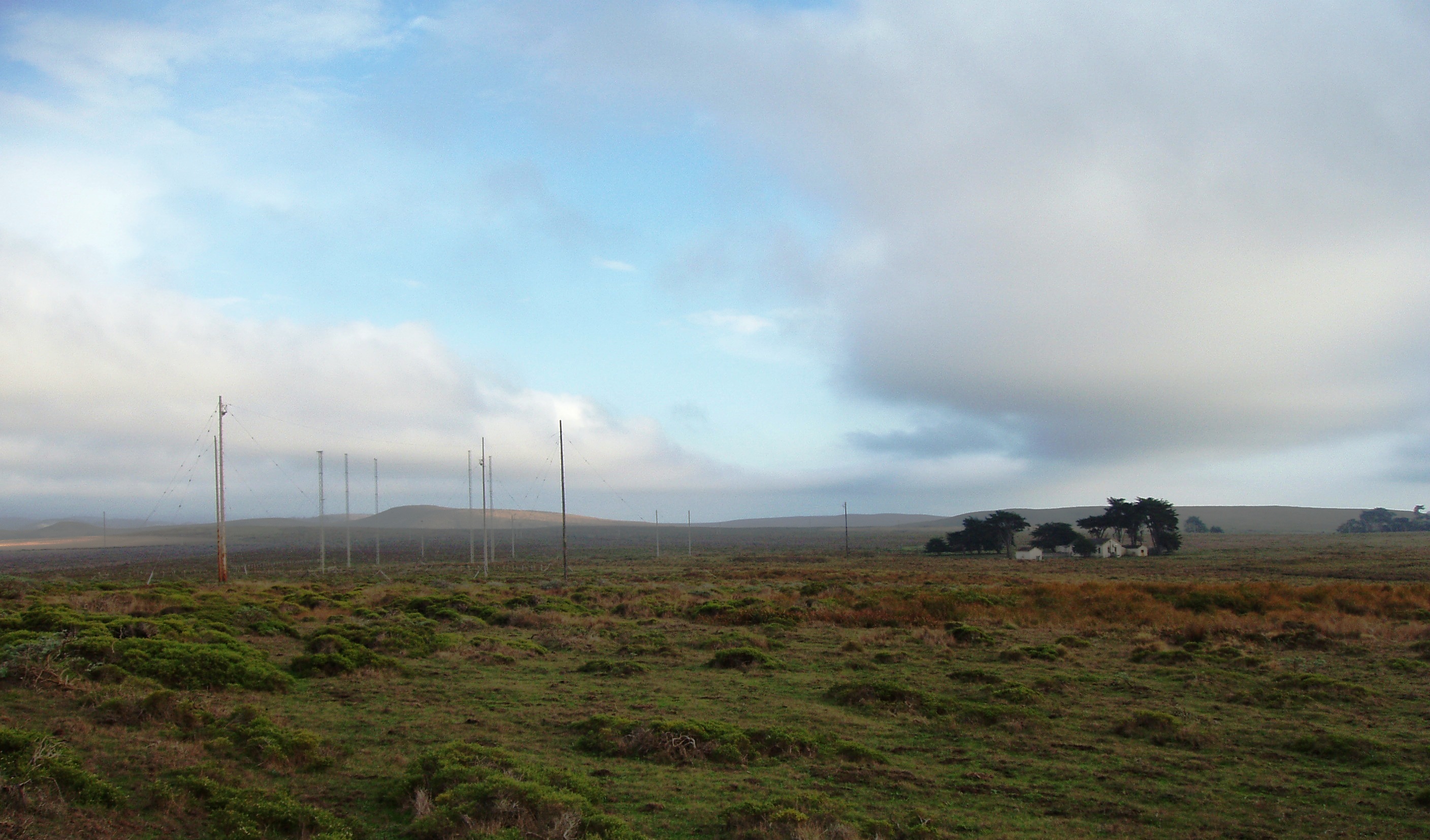 Photo of land and sky with clouds