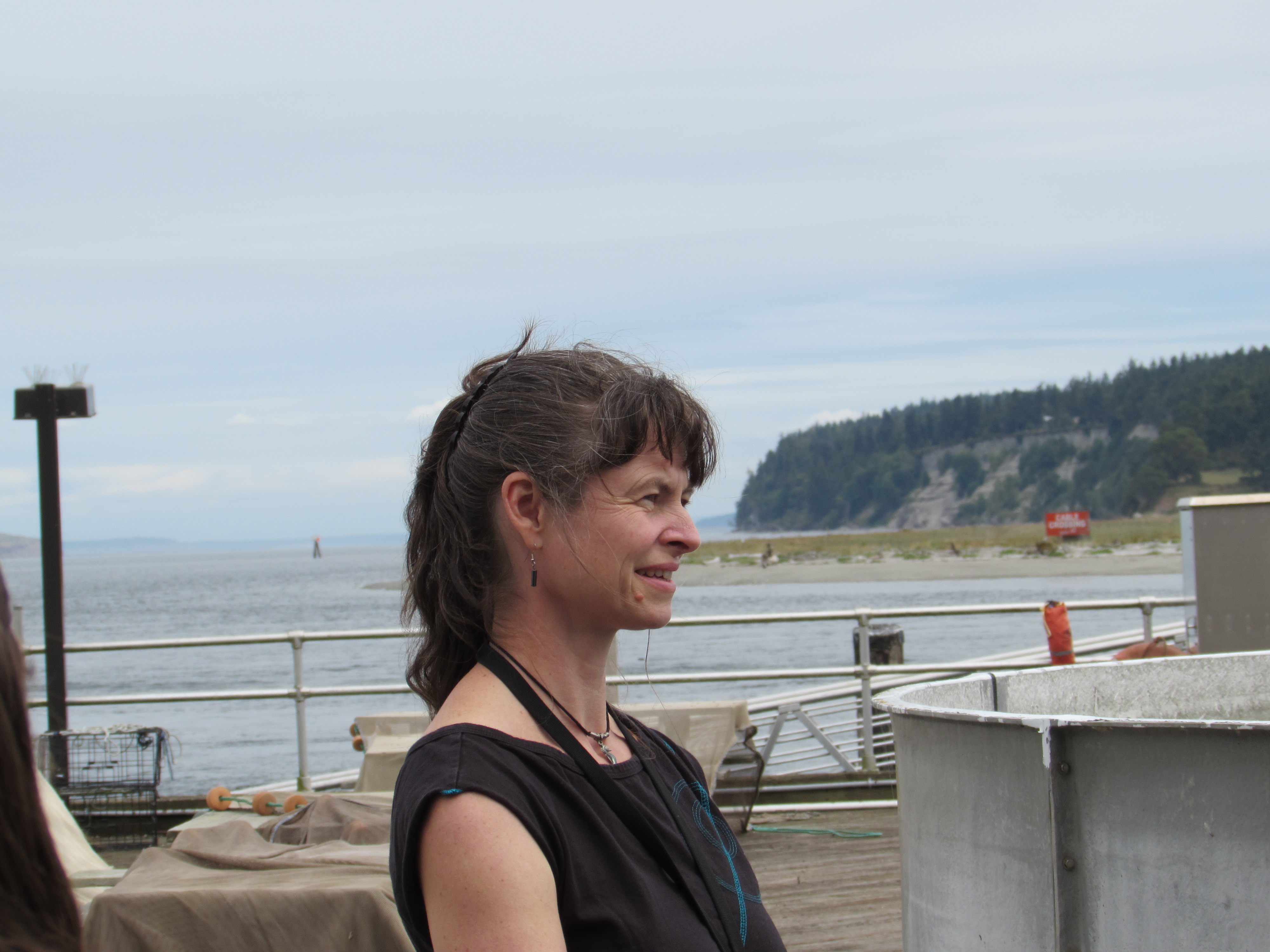 Harker-Klimes looking out to Sequim Bay from the dock at the Marine and Coastal Research Laboratory. 