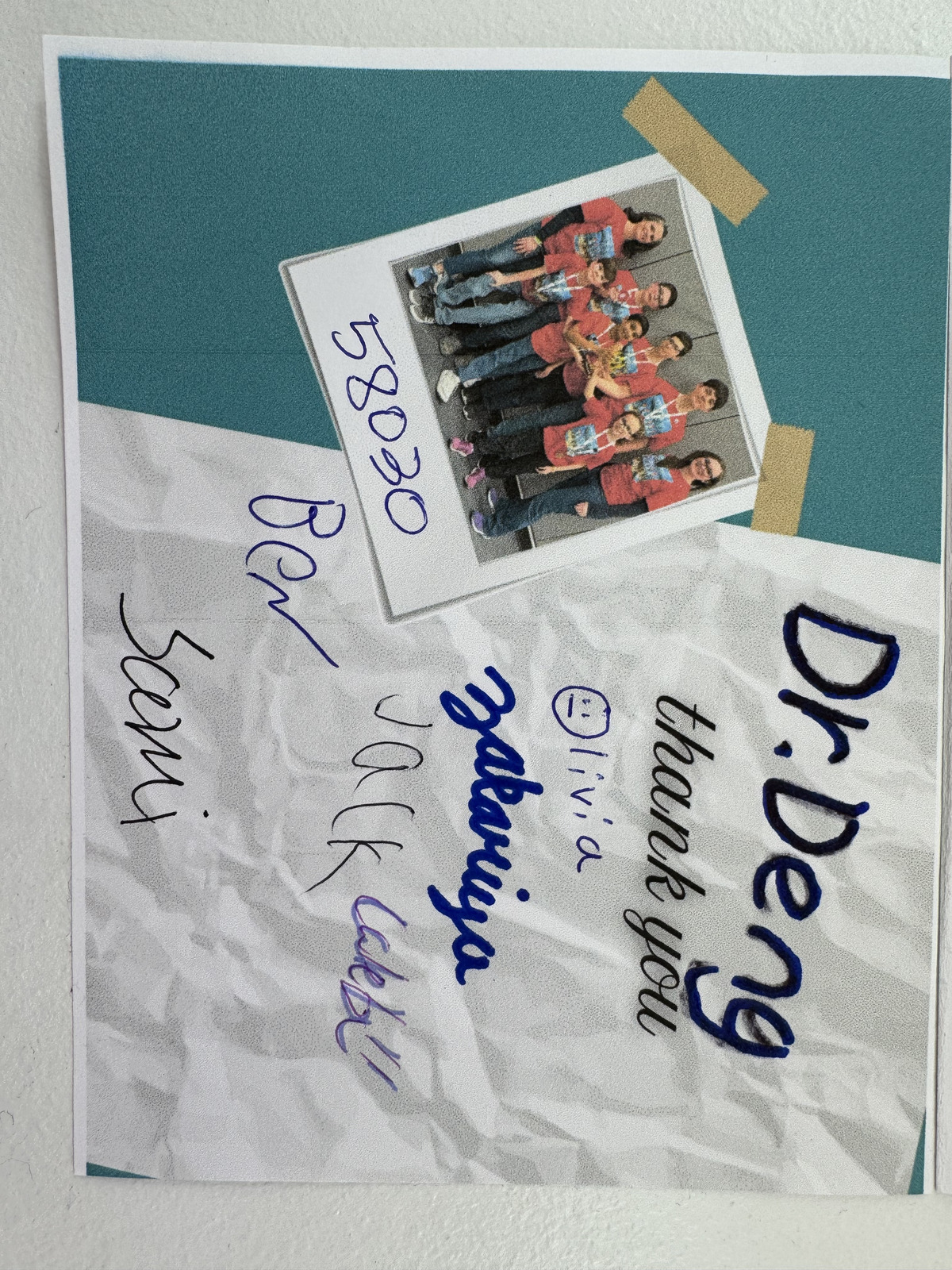 A picture of the LEGO League team 58030 alongside their signatures and a thank you message for Daniel Deng