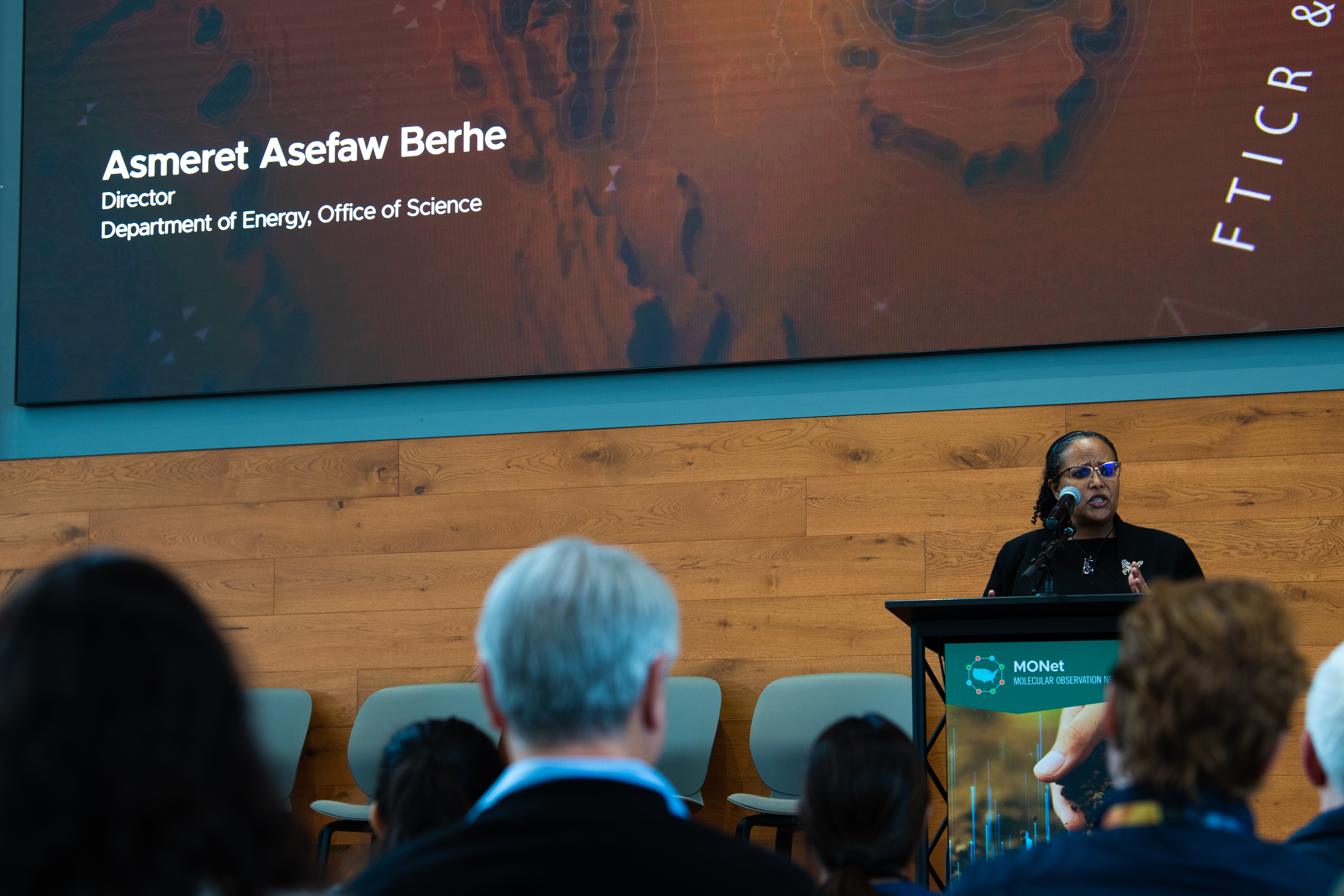 Dr. Berhe at podium speaking during the MONet Launch Ceremony. 