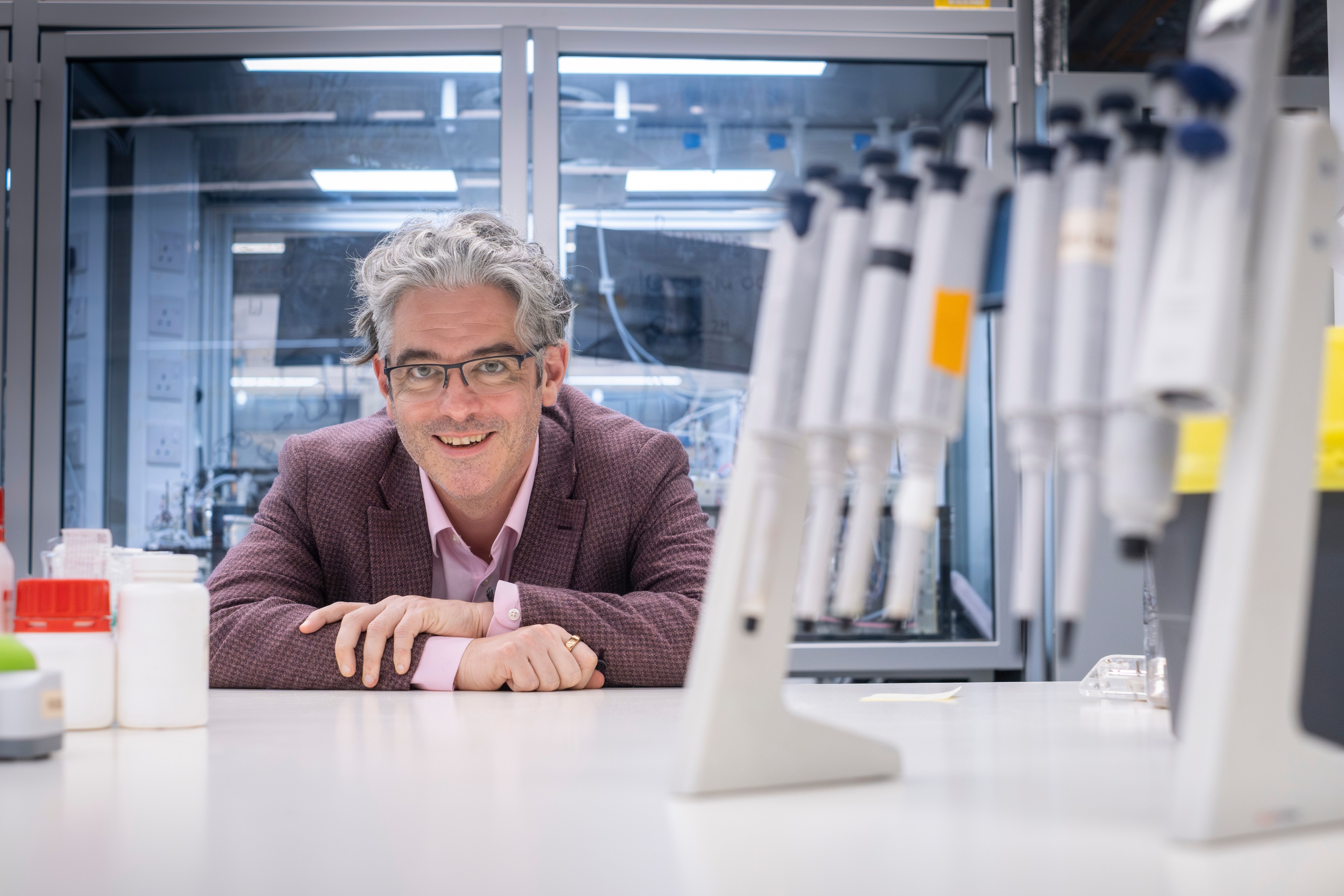 Headshot of Lee Cronin in a laboratory