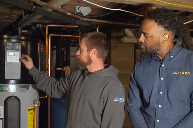 A screenshot of an instructional video from an interactive simulation on heat pump water heater installation, all part of a heat pump water heater training module. (Video by D+R Learn)