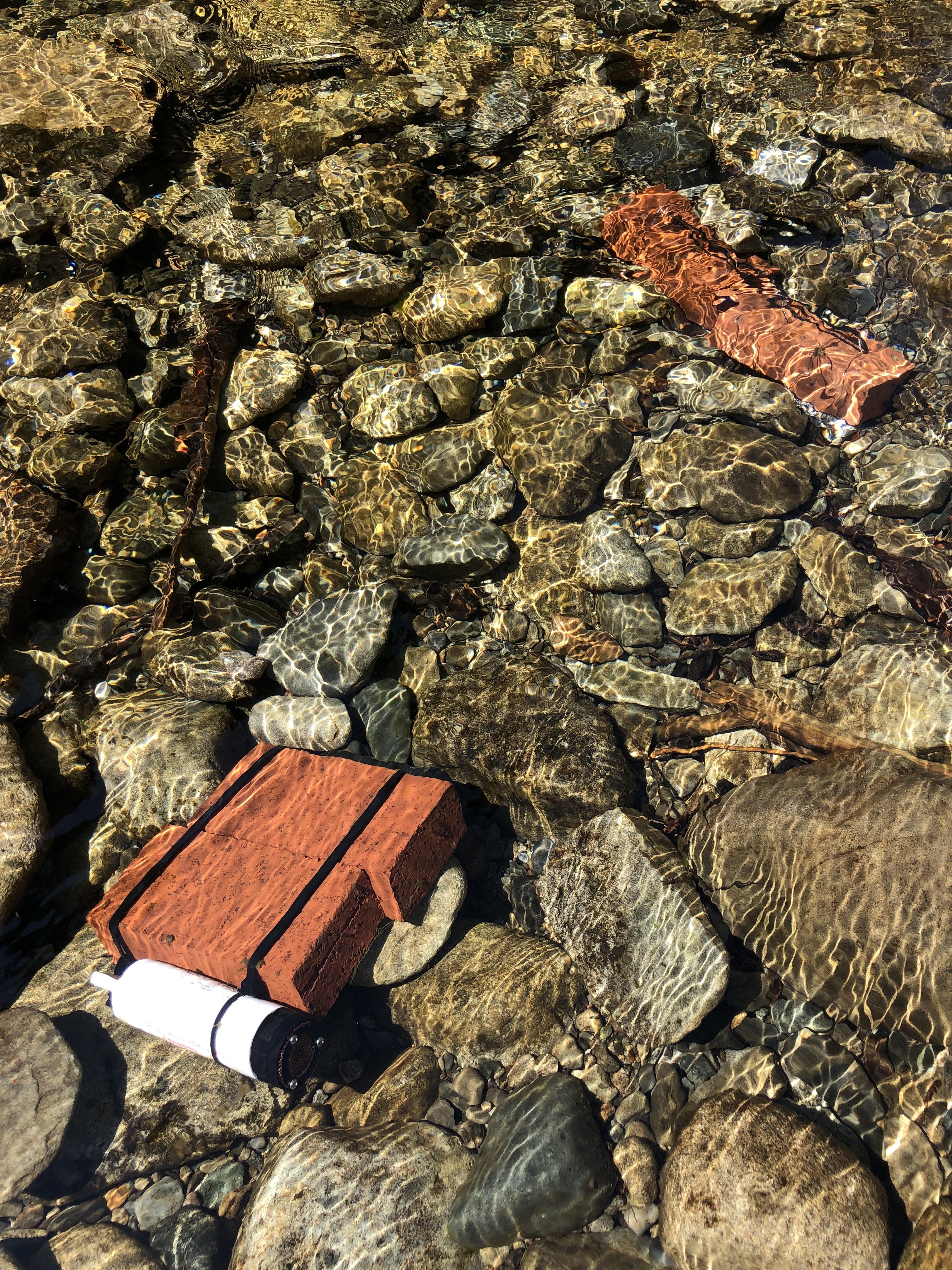 Sensors attached to bricks in a river