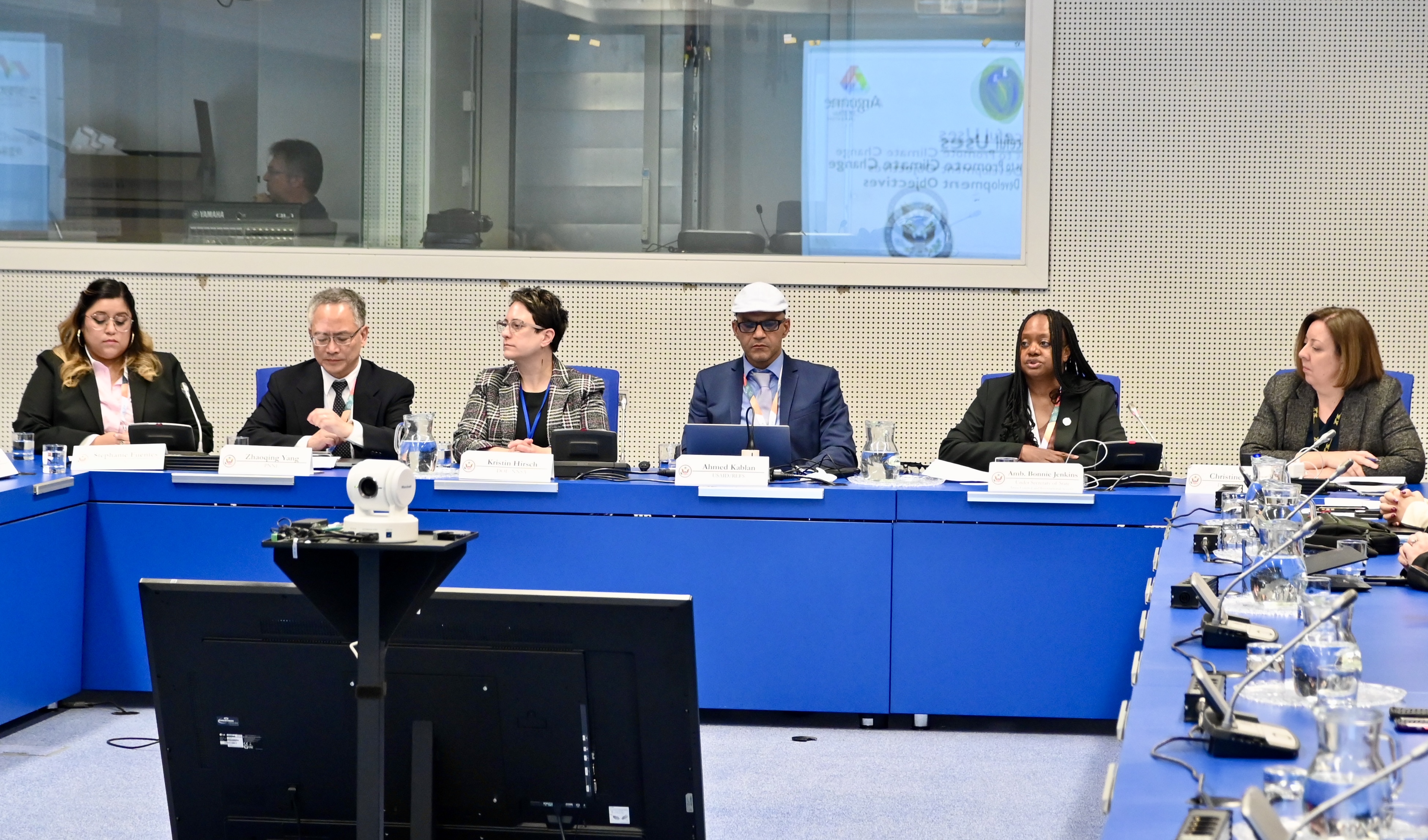 researchers from various scientific fields sitting along a table as an expert panel to speak on different types of modeling