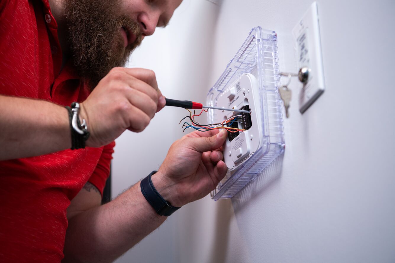 Installing a new thermostat.