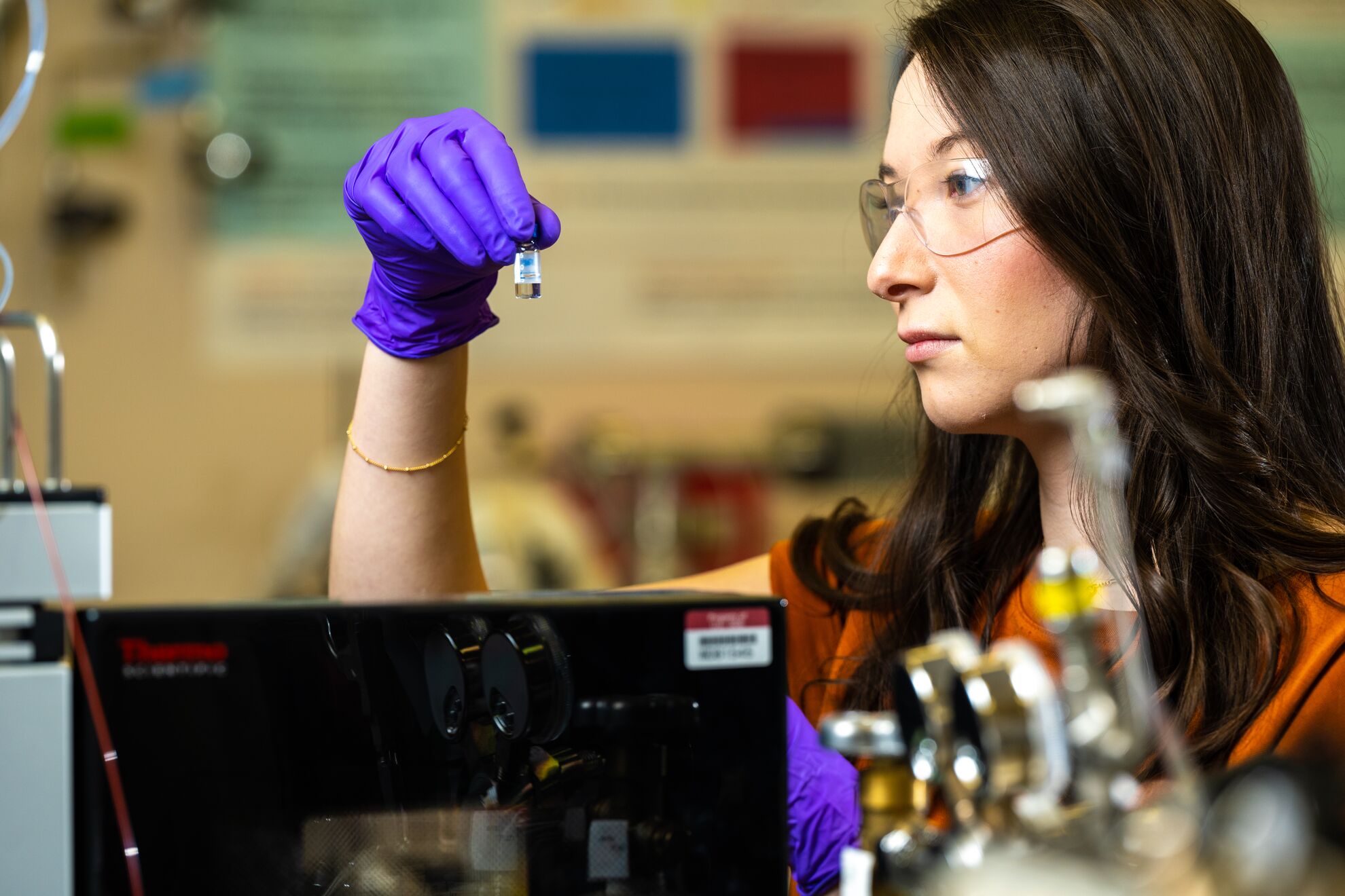 Josie Eder prepares to load samples into a mass spectrometer in EMSL.