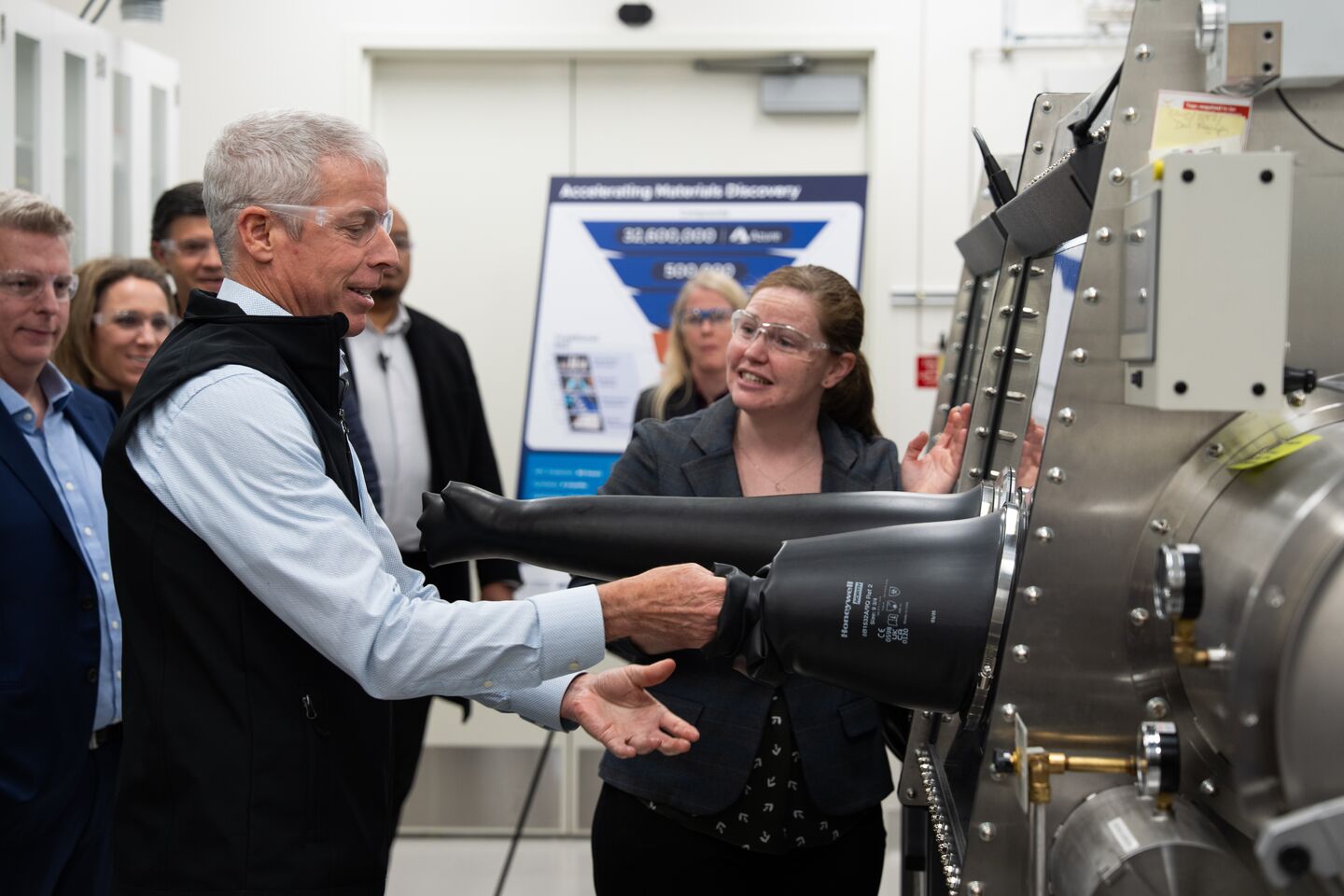Secretary of Energy Chris Wright interacts with a safety glovebox in a lab