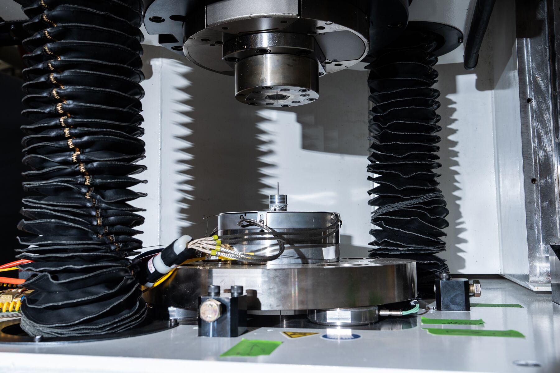 A close-up shot of the ShAPEshifter system showing a tiny die from which extrusions will be produced.
