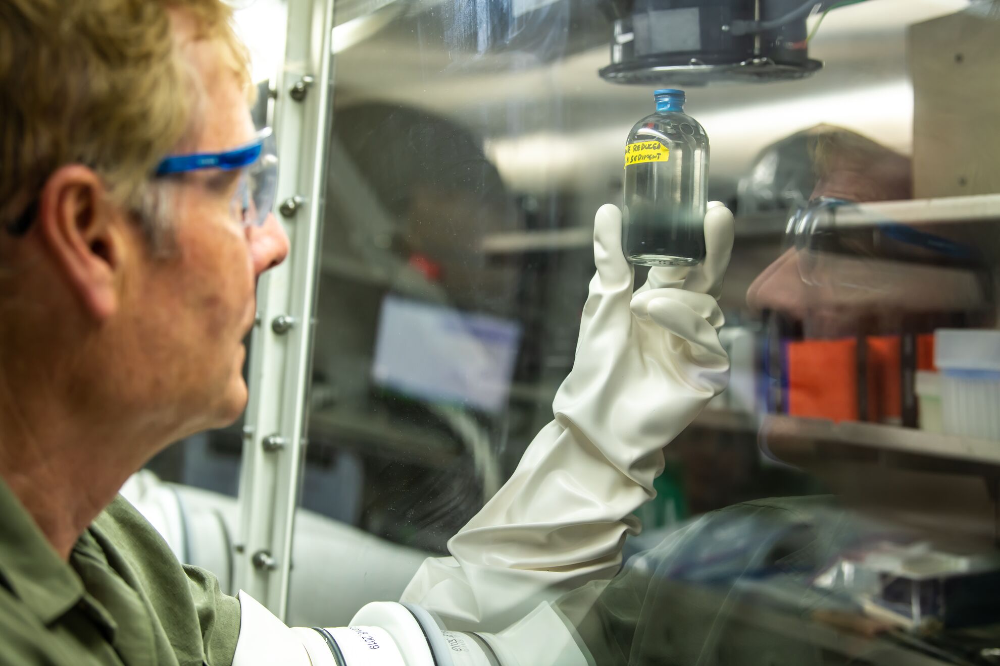 Researcher holding material sample