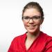 Photo of a woman in a red shirt with glasses. 