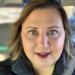 tight focus on Rebecca Redeker smiling toward the camera