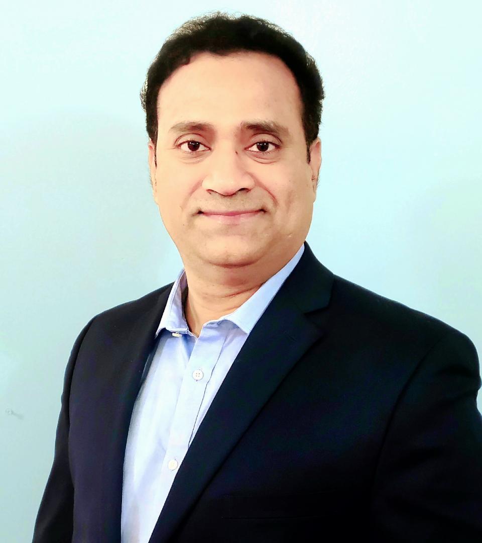 Smiling man in black jacket