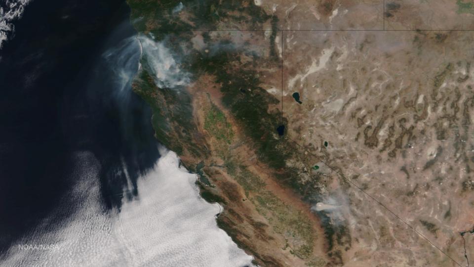 Satellite photo of California with clouds off the coast.