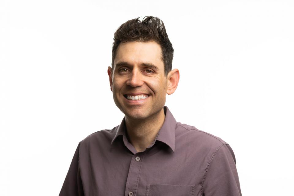 Smiling man with dark hair