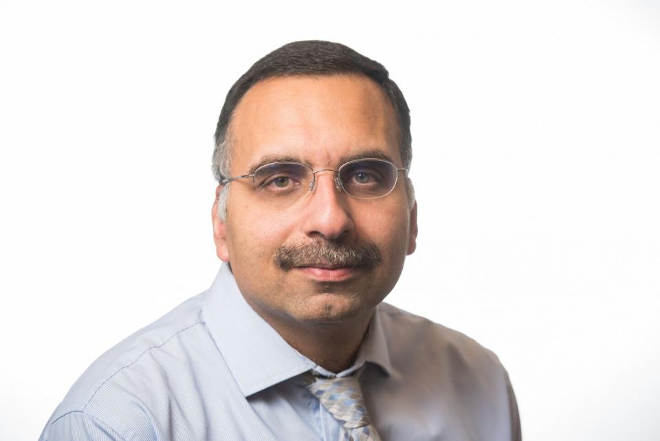 Man with mustache and glasses