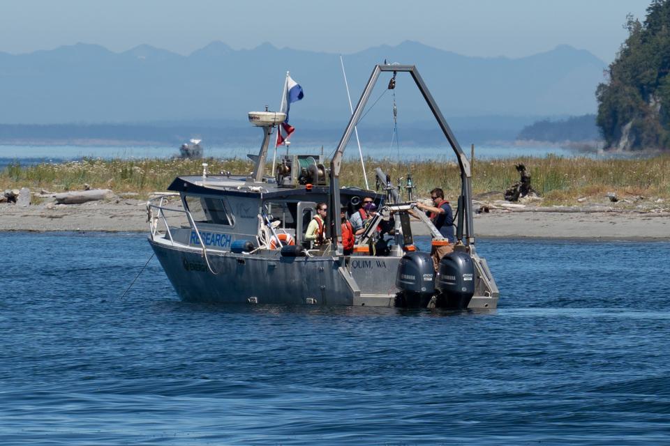 The Triton team conducting tests on underwater noise monitoring technologies from a boat.