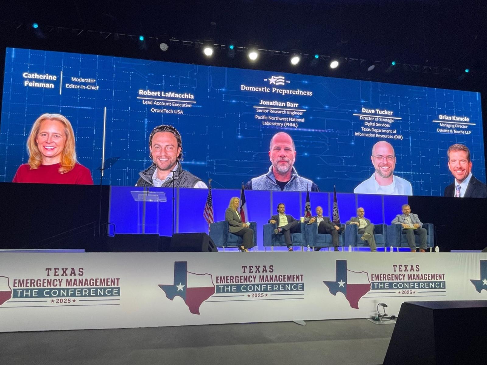 five people sitting in chairs on a stage at the Texas emergency management conference