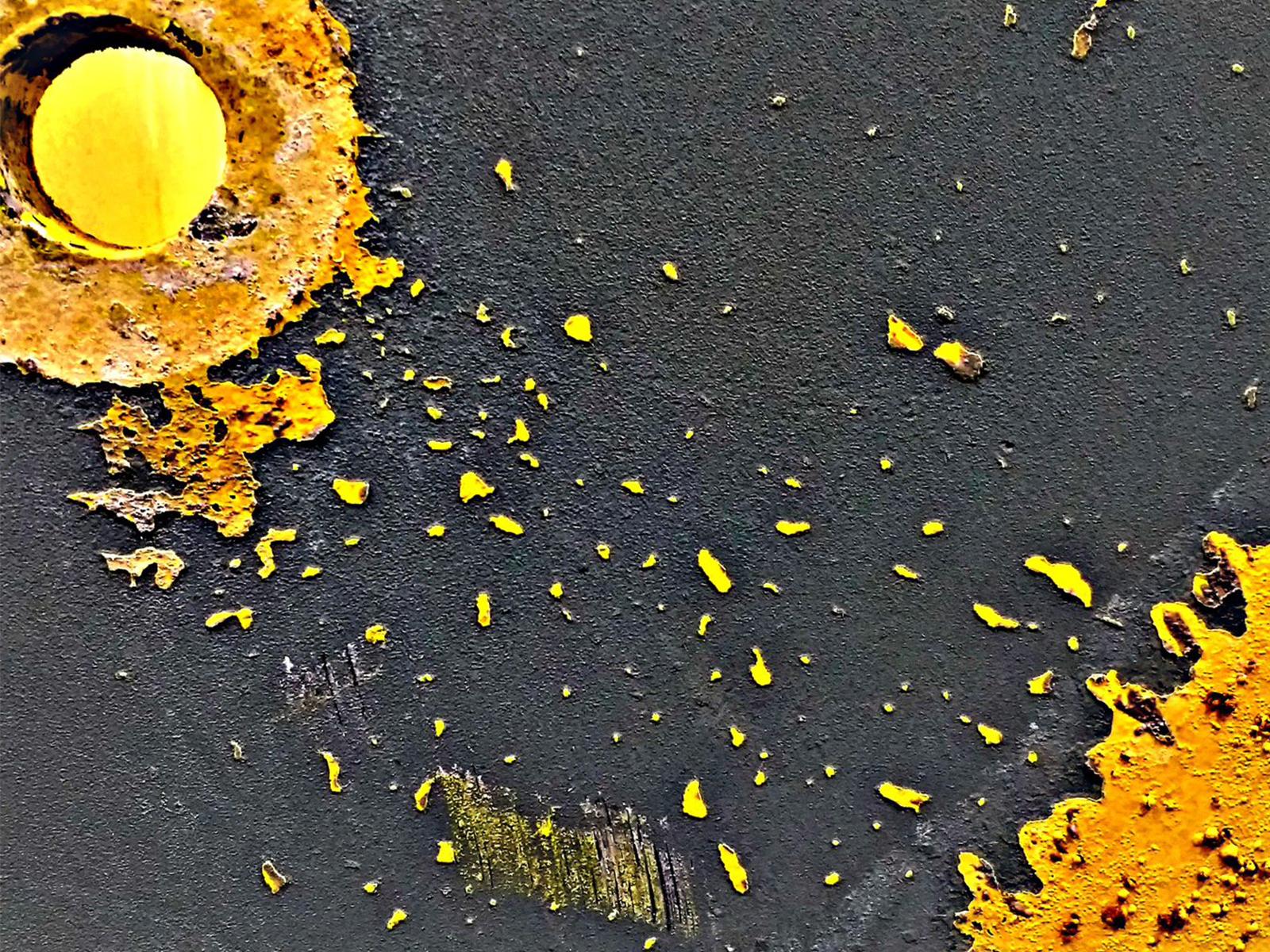 Photo of bolt hole and peeling paint from decommissioned RPM shell