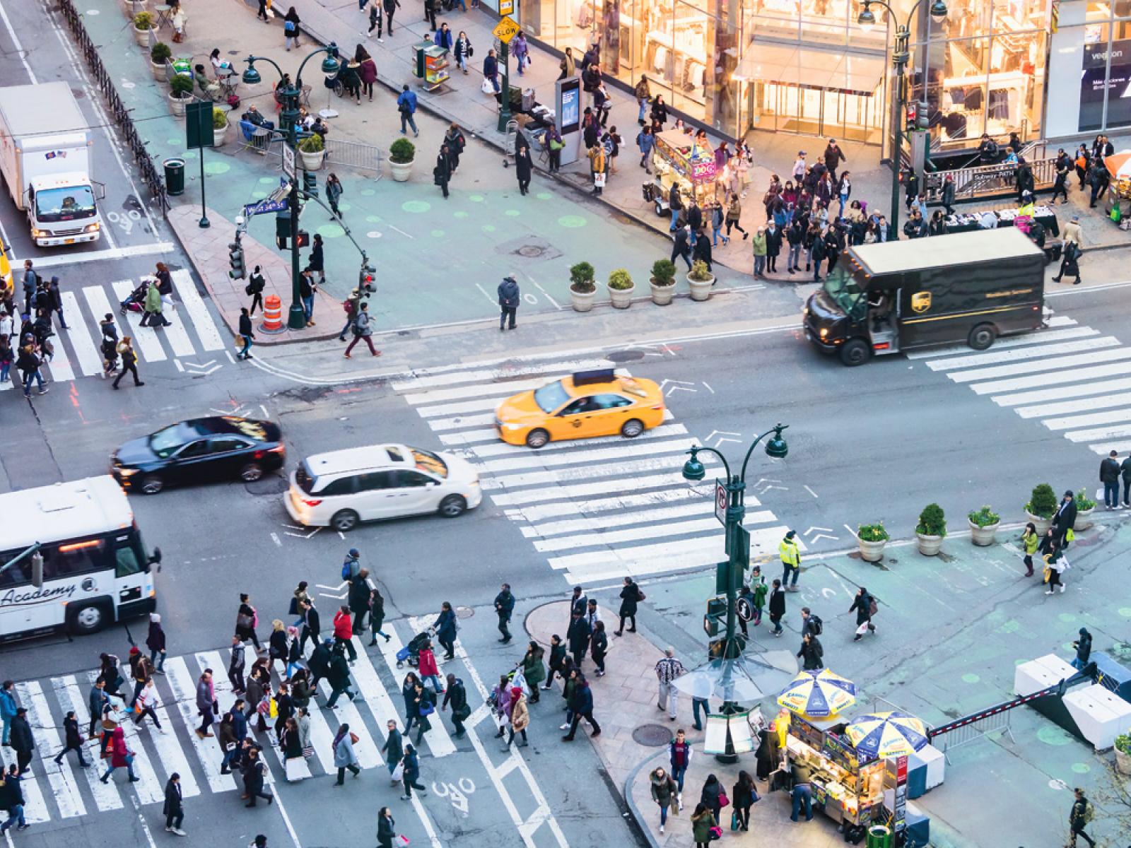 People and traffic on busy street