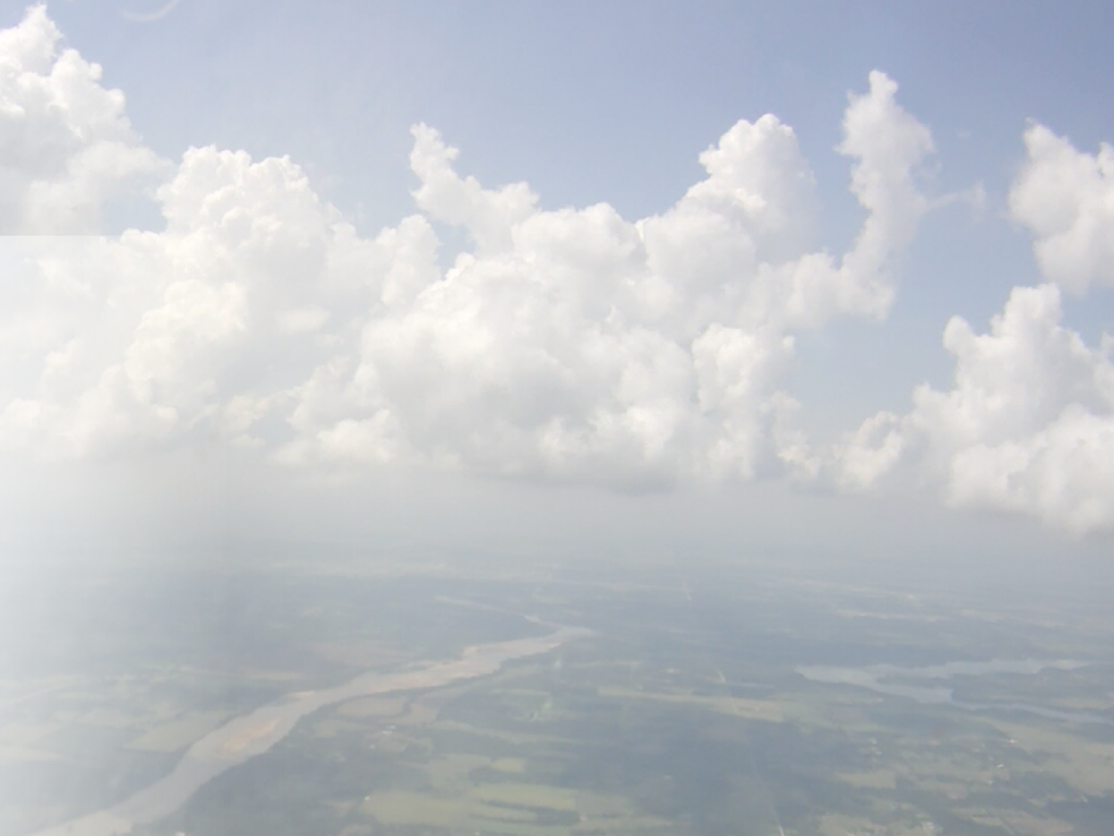 Photo of clouds in a sky from an airplane view