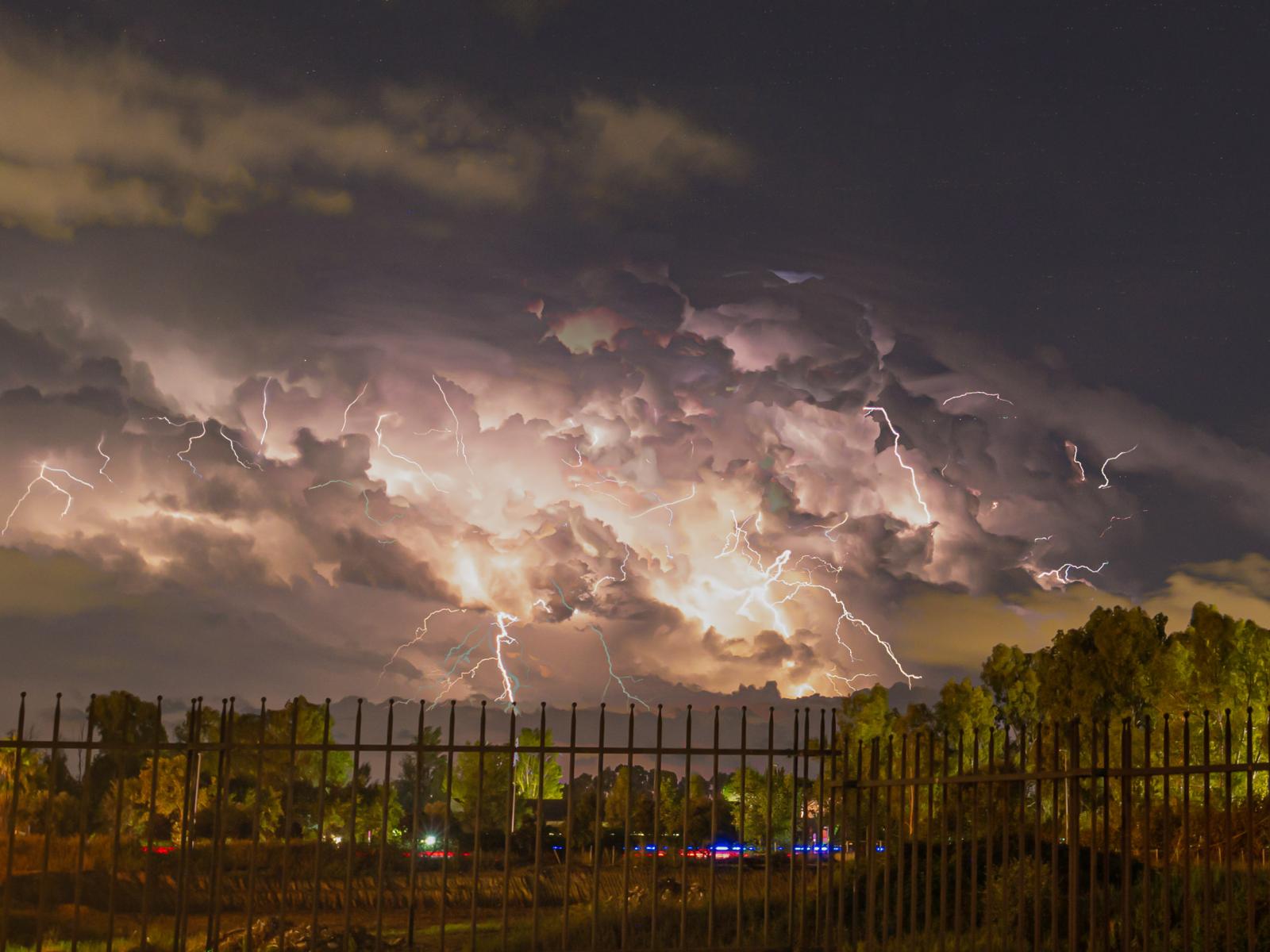 Photograph of a storm with lightning and clouds