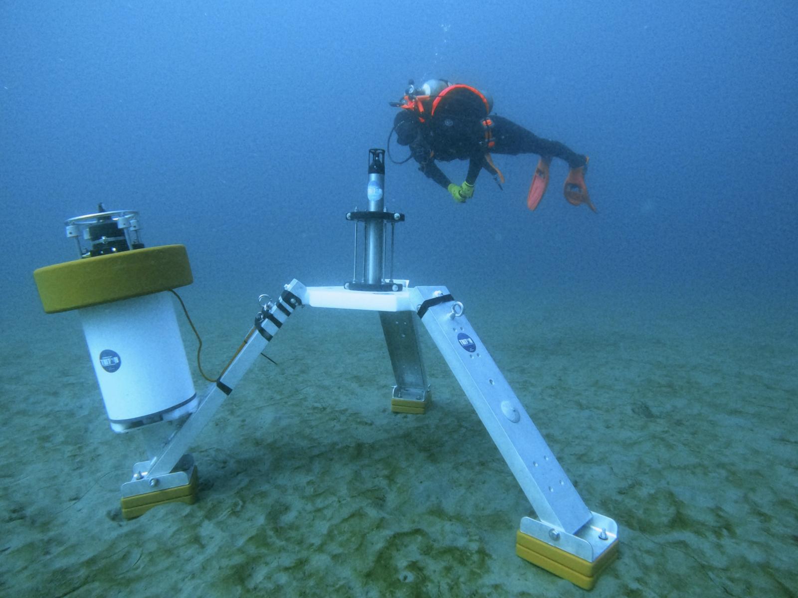 Hydrophone lander on the seafloor with a research diver nearby