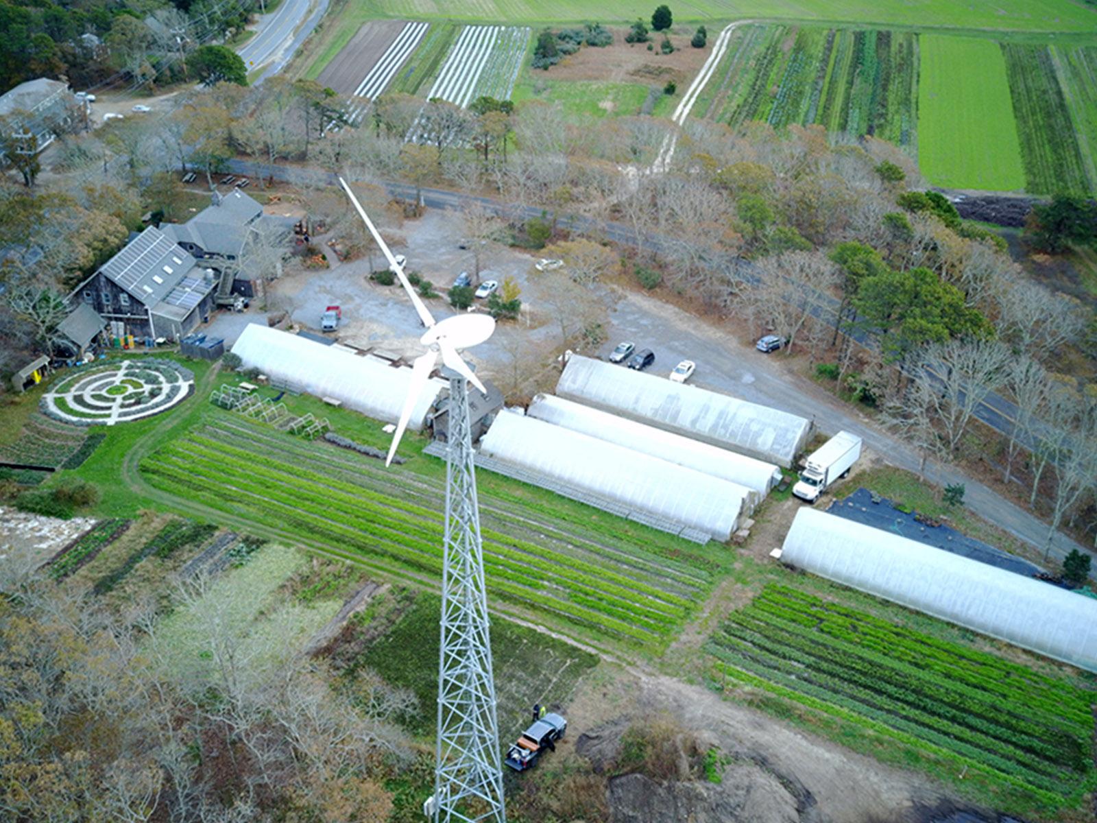turbine above green area with farm