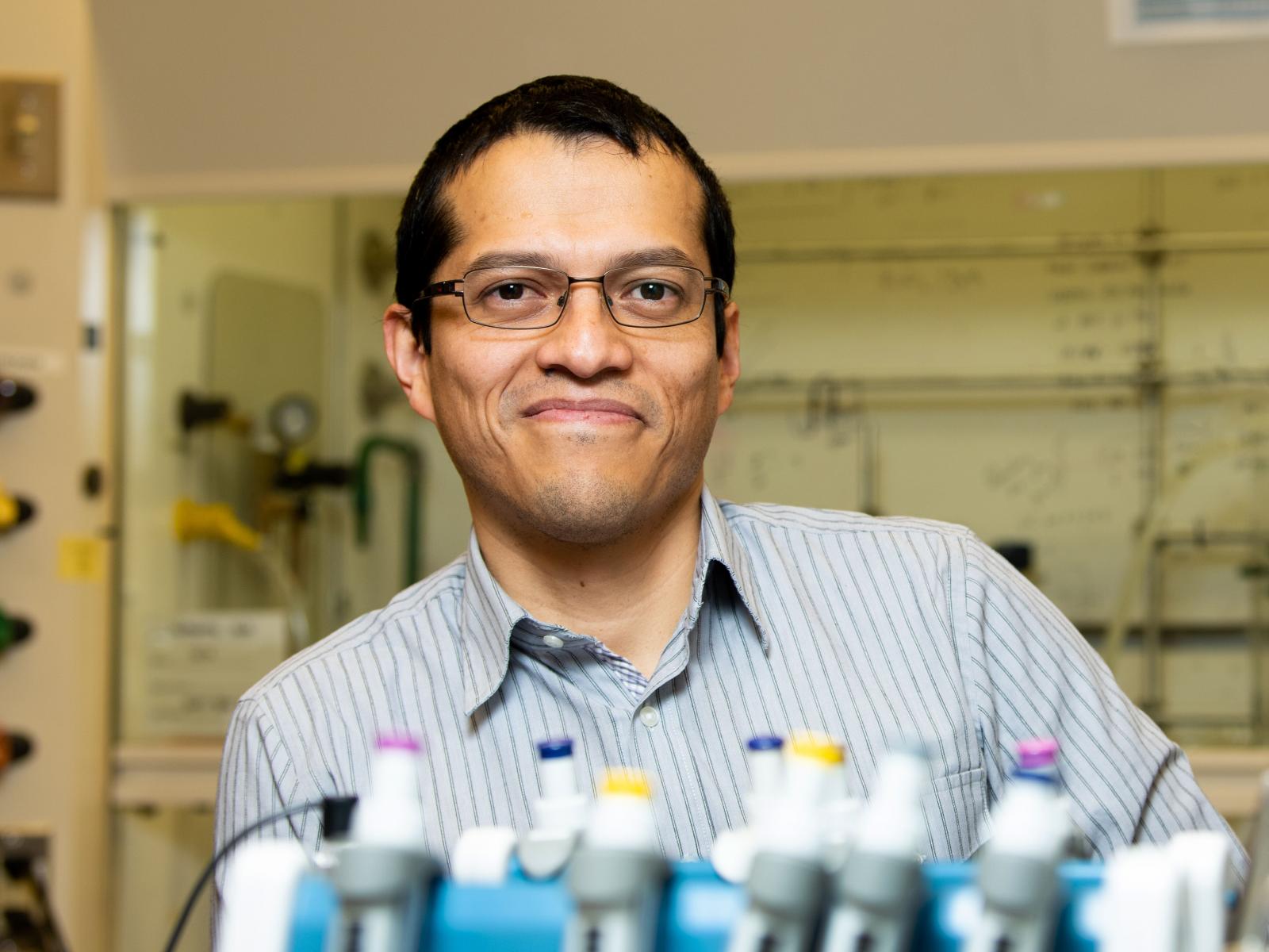 Chemical engineer Oliver Y. Gutiérrez poses in a laboratory in the Physical Sciences Laboratory building.