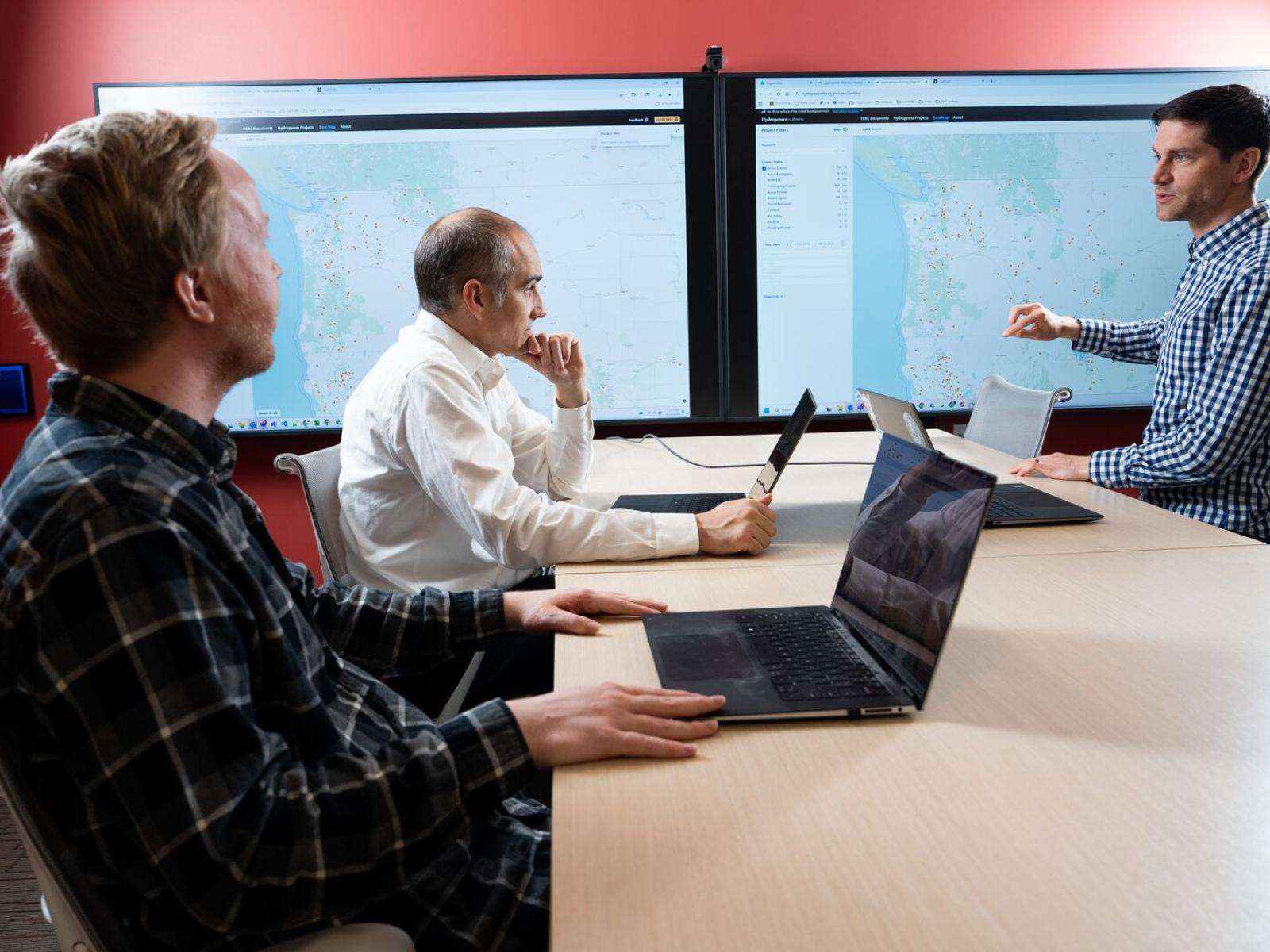 PNNL researchers conversing